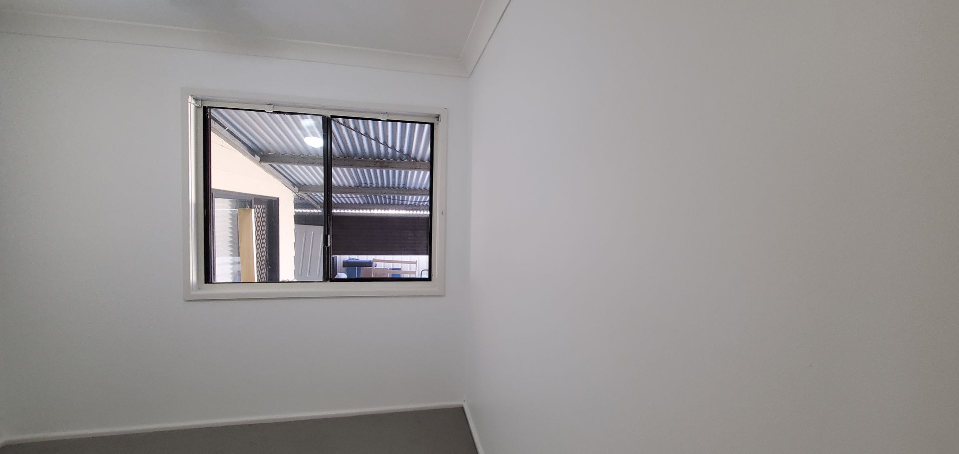 There is a window in the corner of the room — JWP Painting & Property Services in Ettalong Beach, NSW