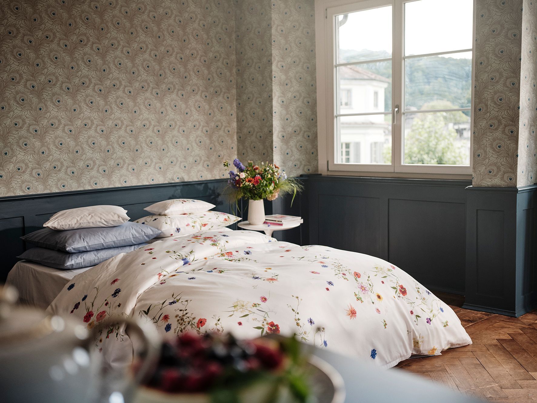 A bedroom with a large bed and a window