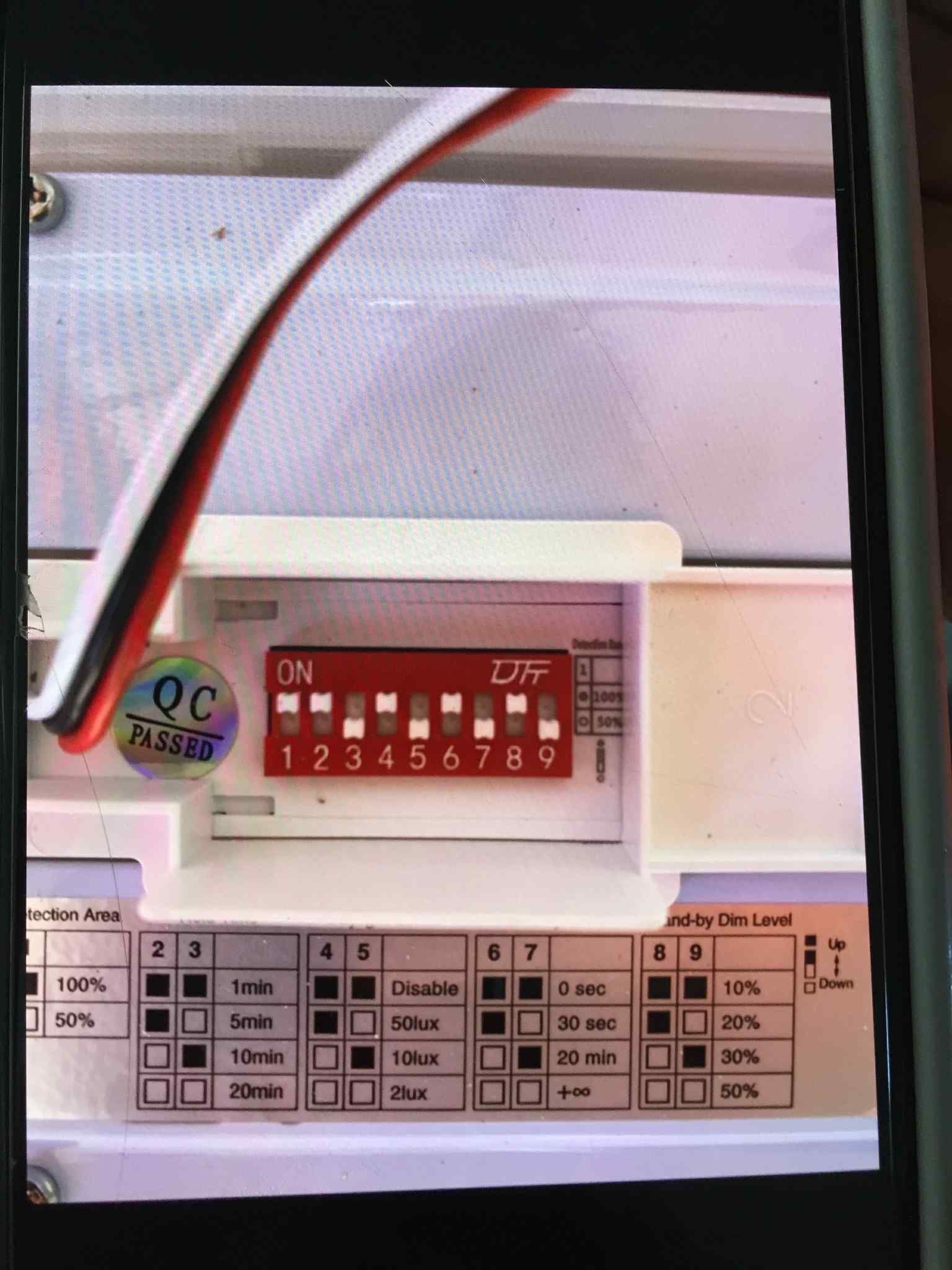 Ziesing Electrical: Digital meter/timer and terminal block with connected wires during electrical testing and commissioning.
