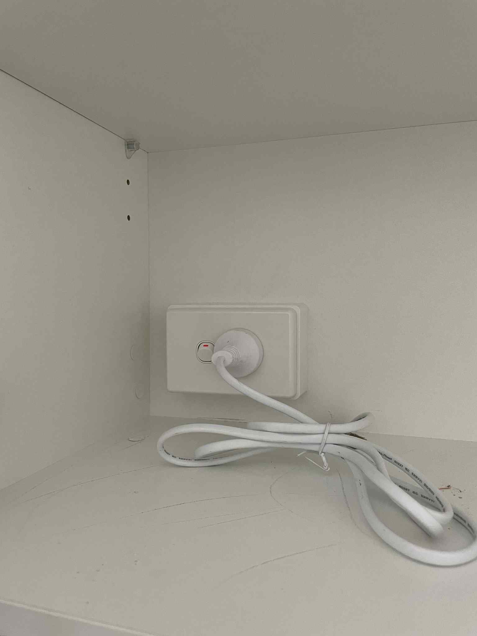 Three-gang light switch aligned neatly on interior wall