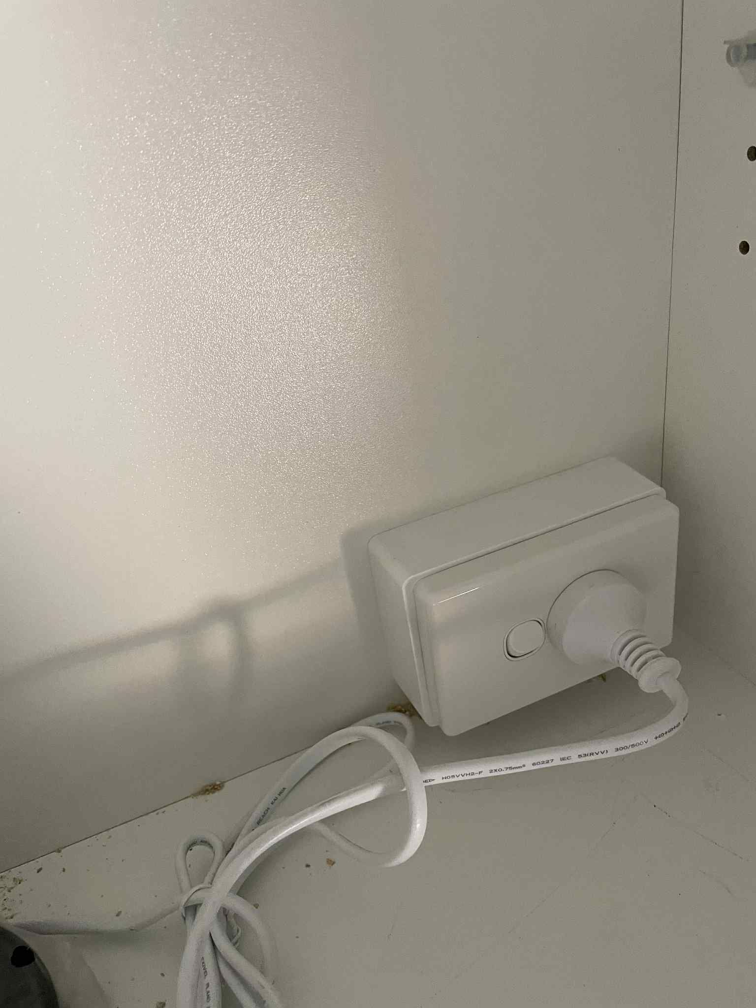 Electrician replacing cracked power point cover for safety