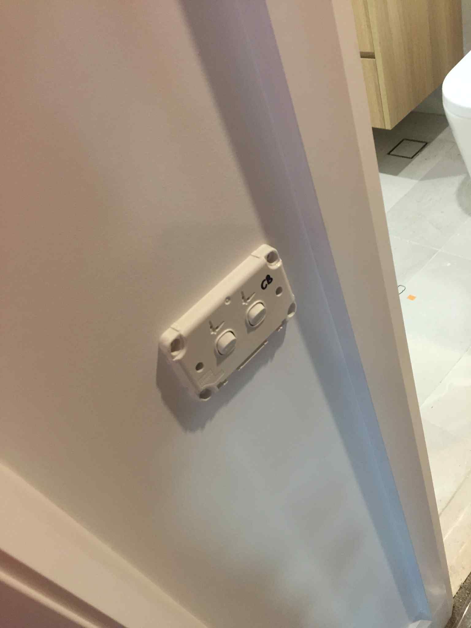 Flush-mounted twin power outlet installed beside a kitchen island during appliance wiring in Hampton