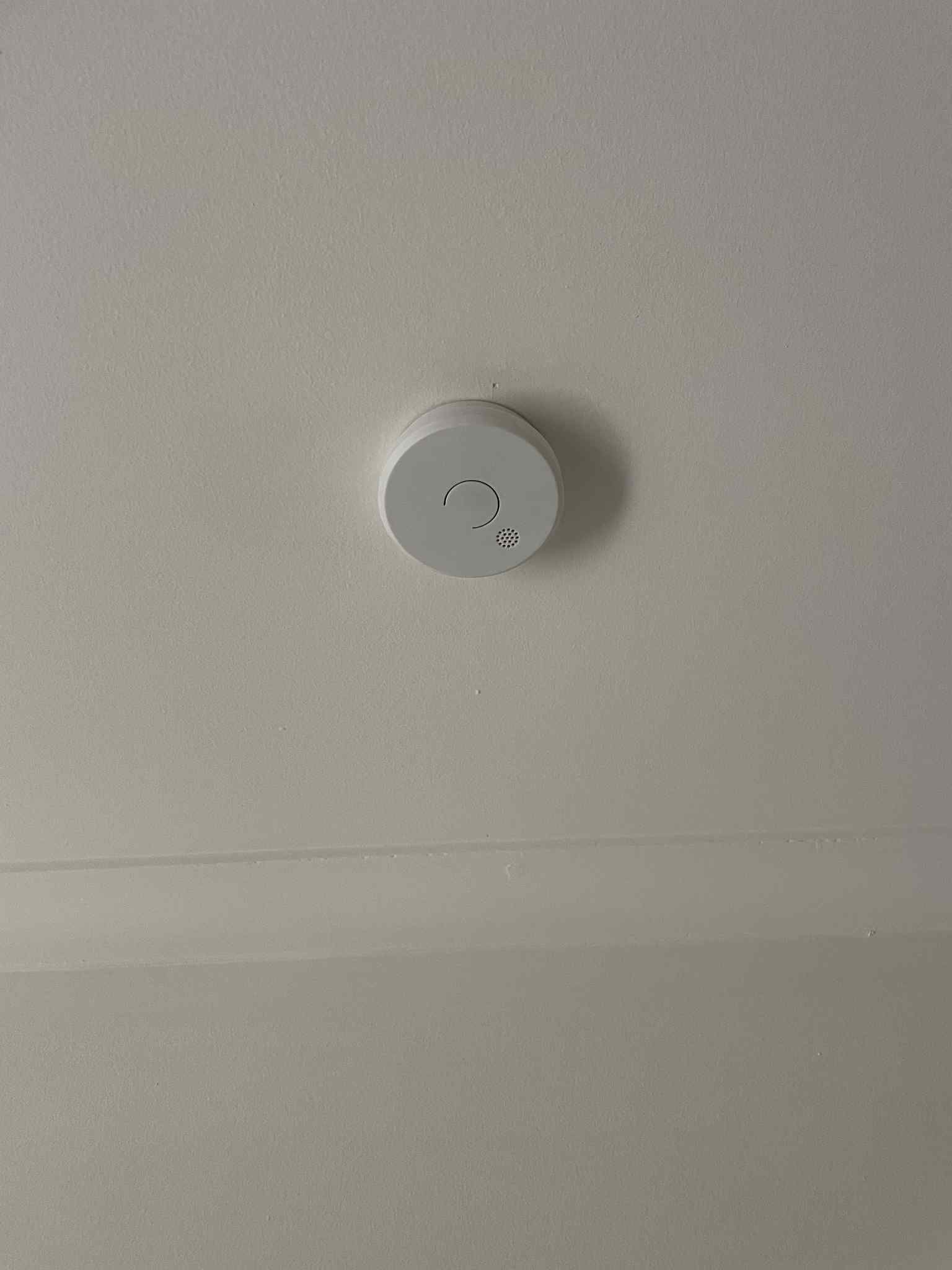 Modern round ceiling light glowing in living room