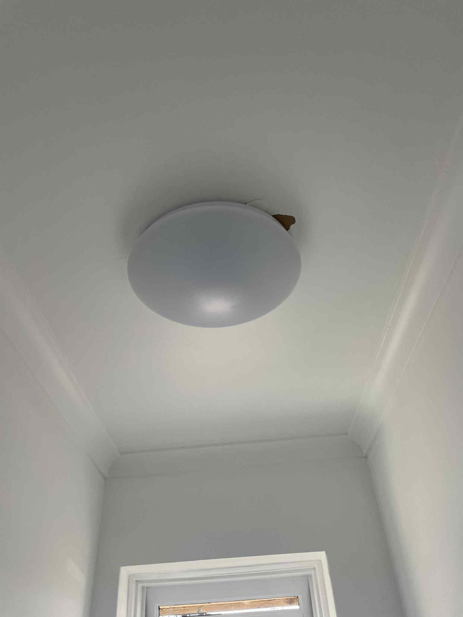 Row of LED strip lights fitted under kitchen cabinets