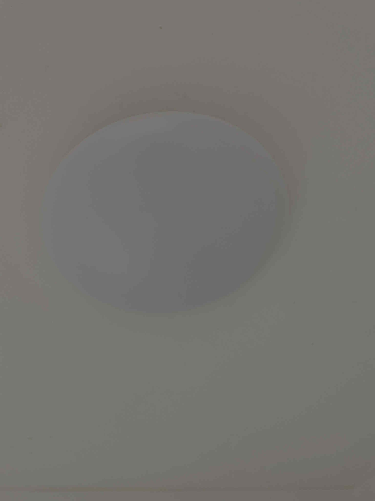 utdoor floodlight mounted on house exterior, illuminated