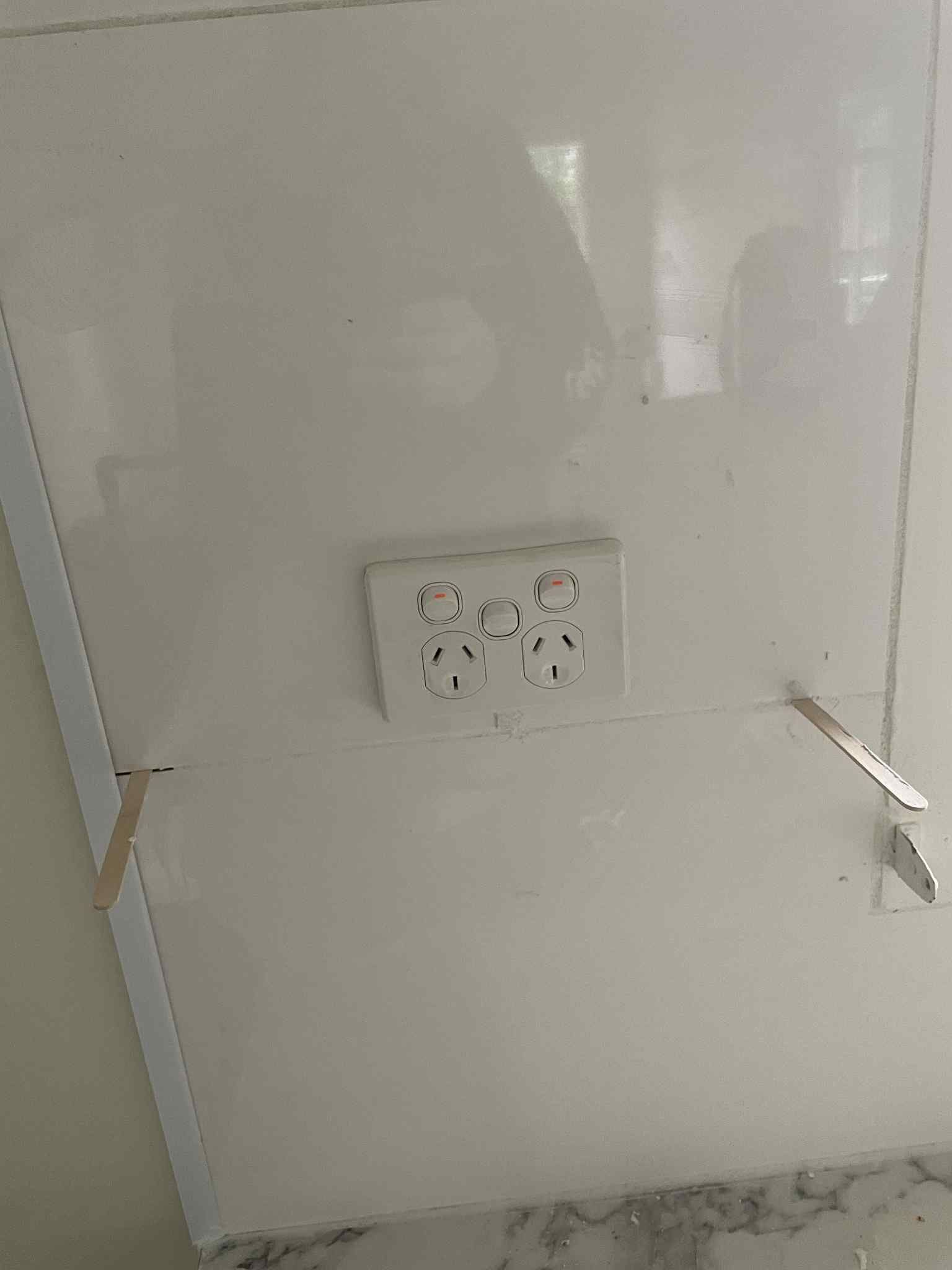 New light switches installed neatly on painted wall