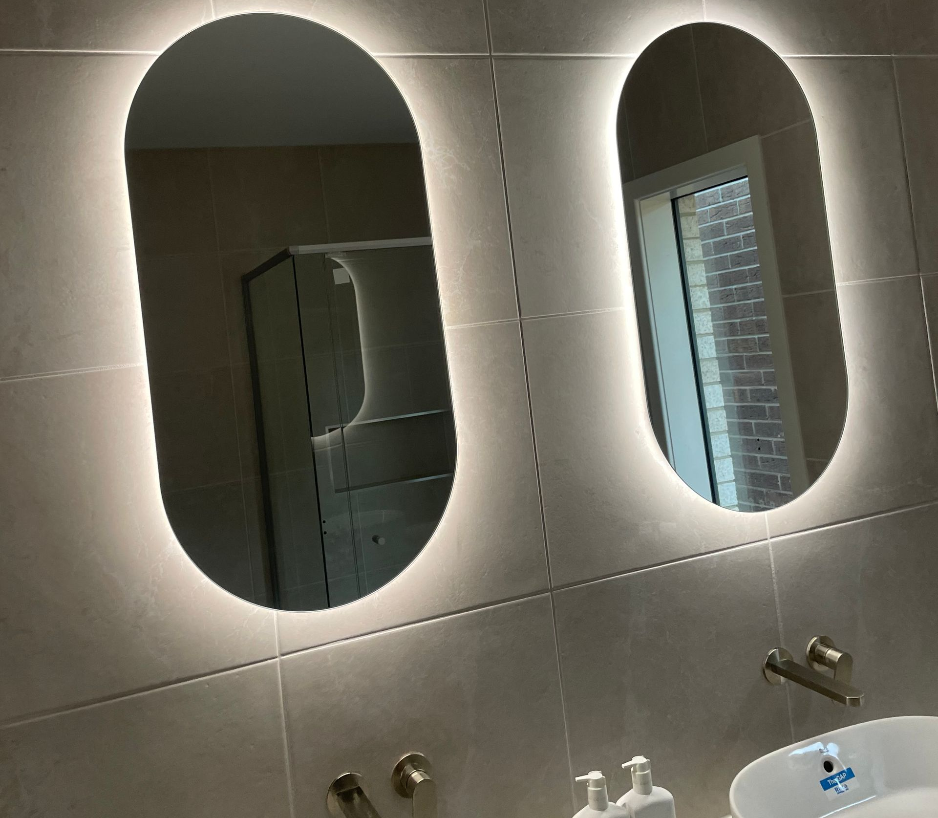 beautiful light installed on bathroom wall in bayside