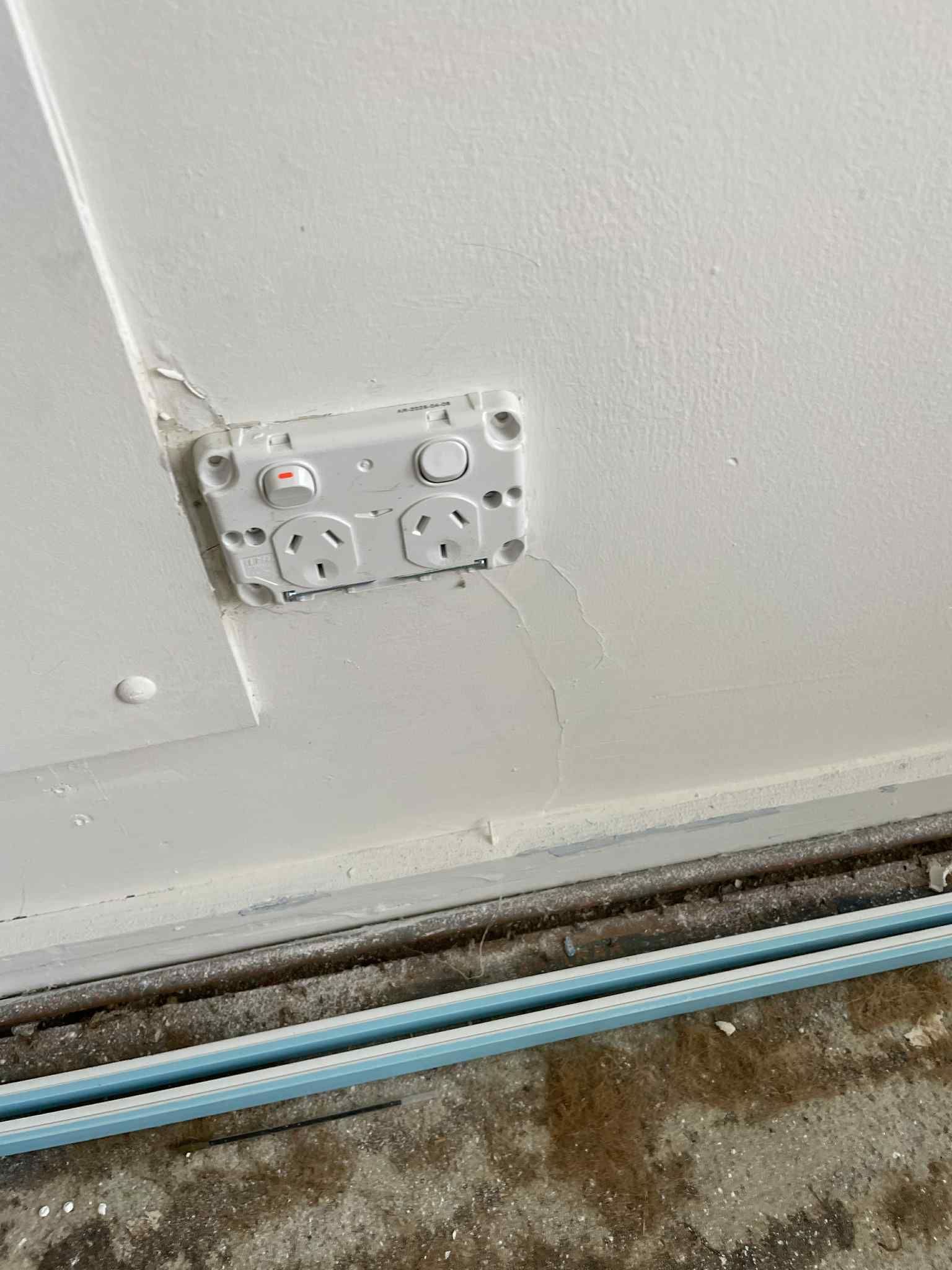 Double power outlet on wall