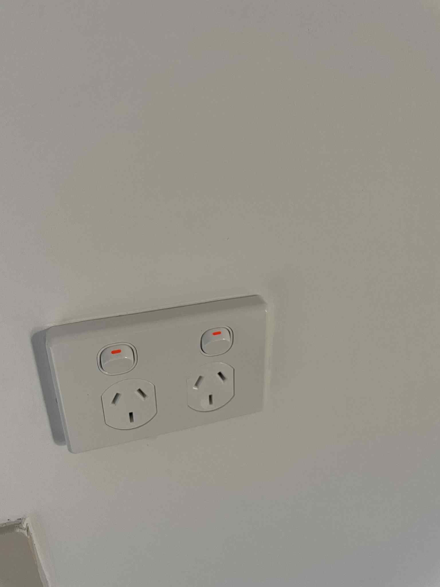 Close-up of round light fitting with frosted glass cover