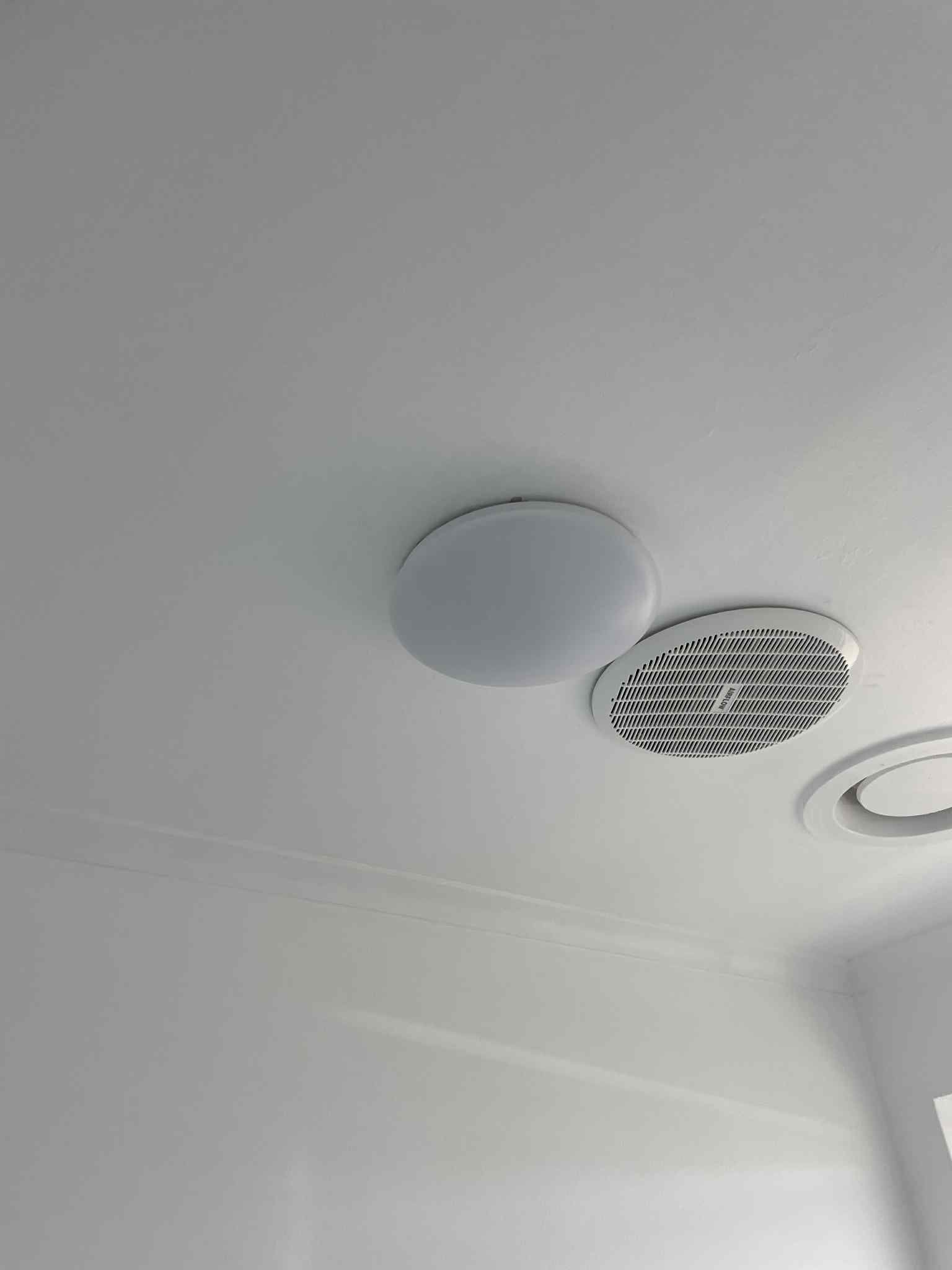 Electrician wiring light fixture