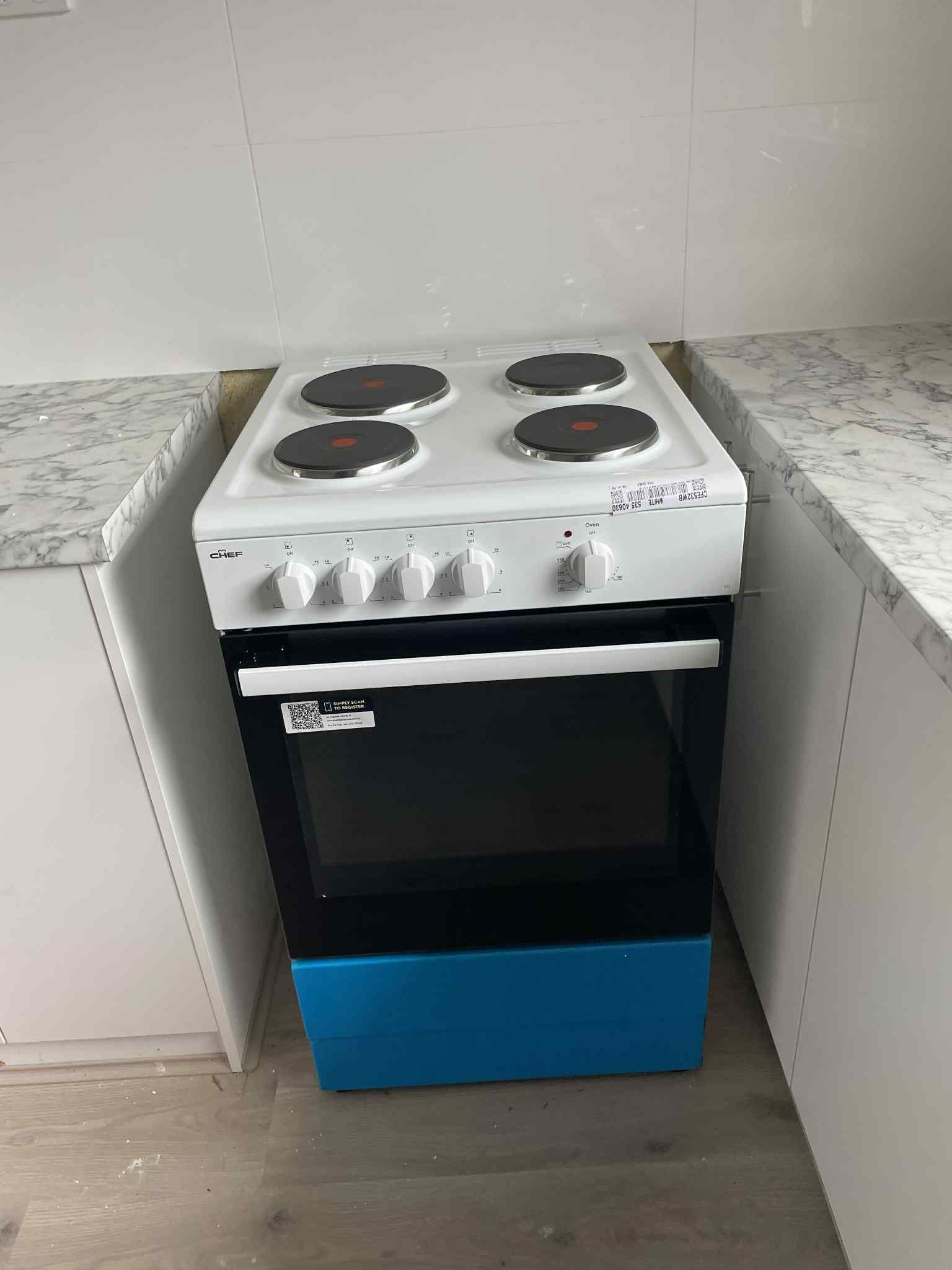 Built-in electric oven installed in kitchen with control panel visible