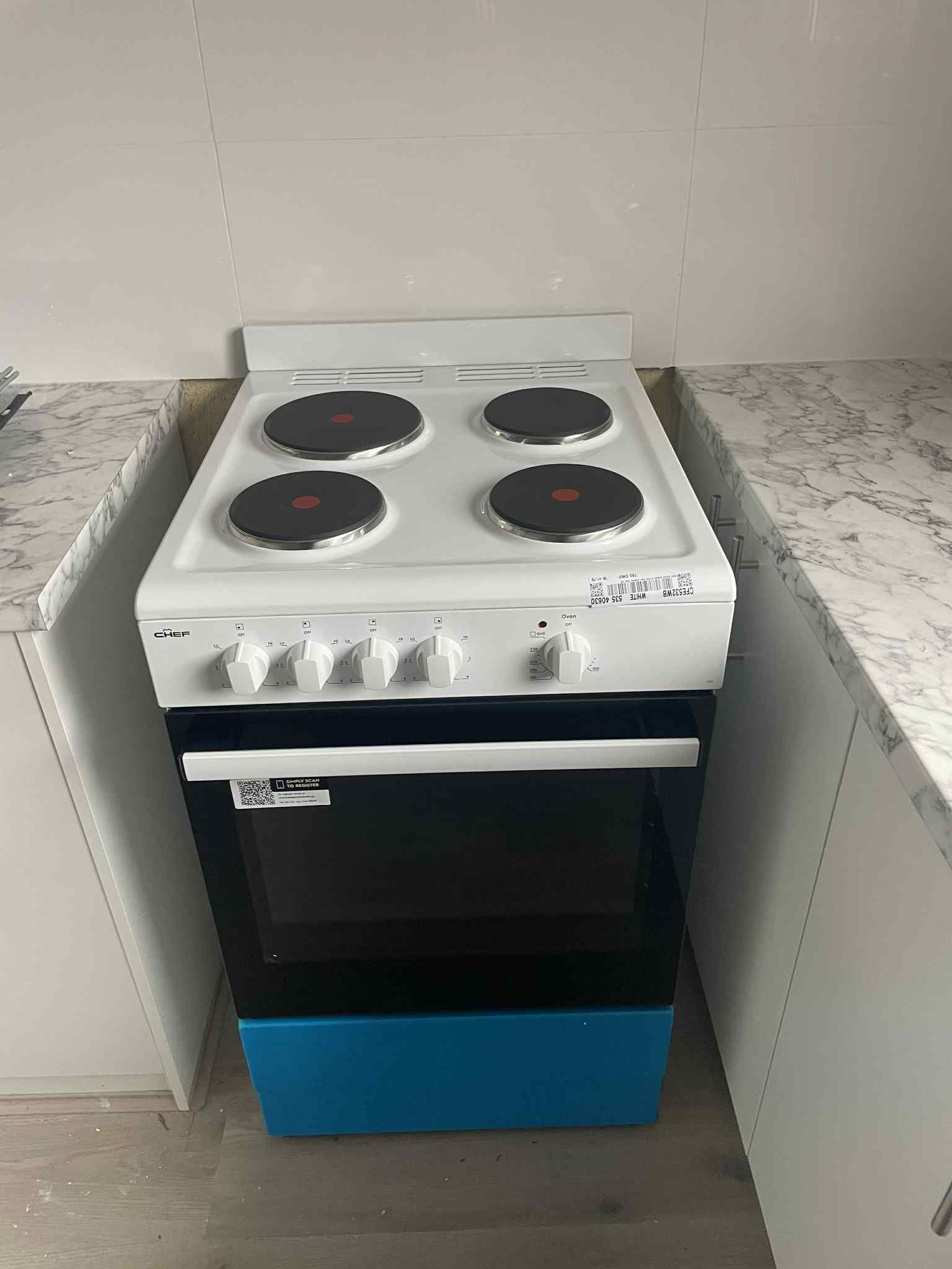 Front view of stainless steel electric oven with closed door