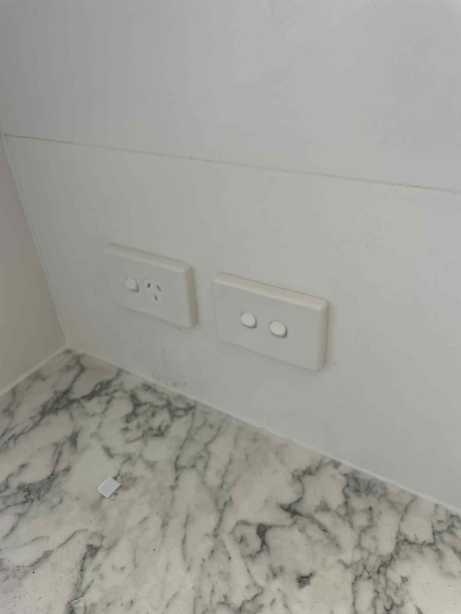 White wall switch installed by licensed electrician
