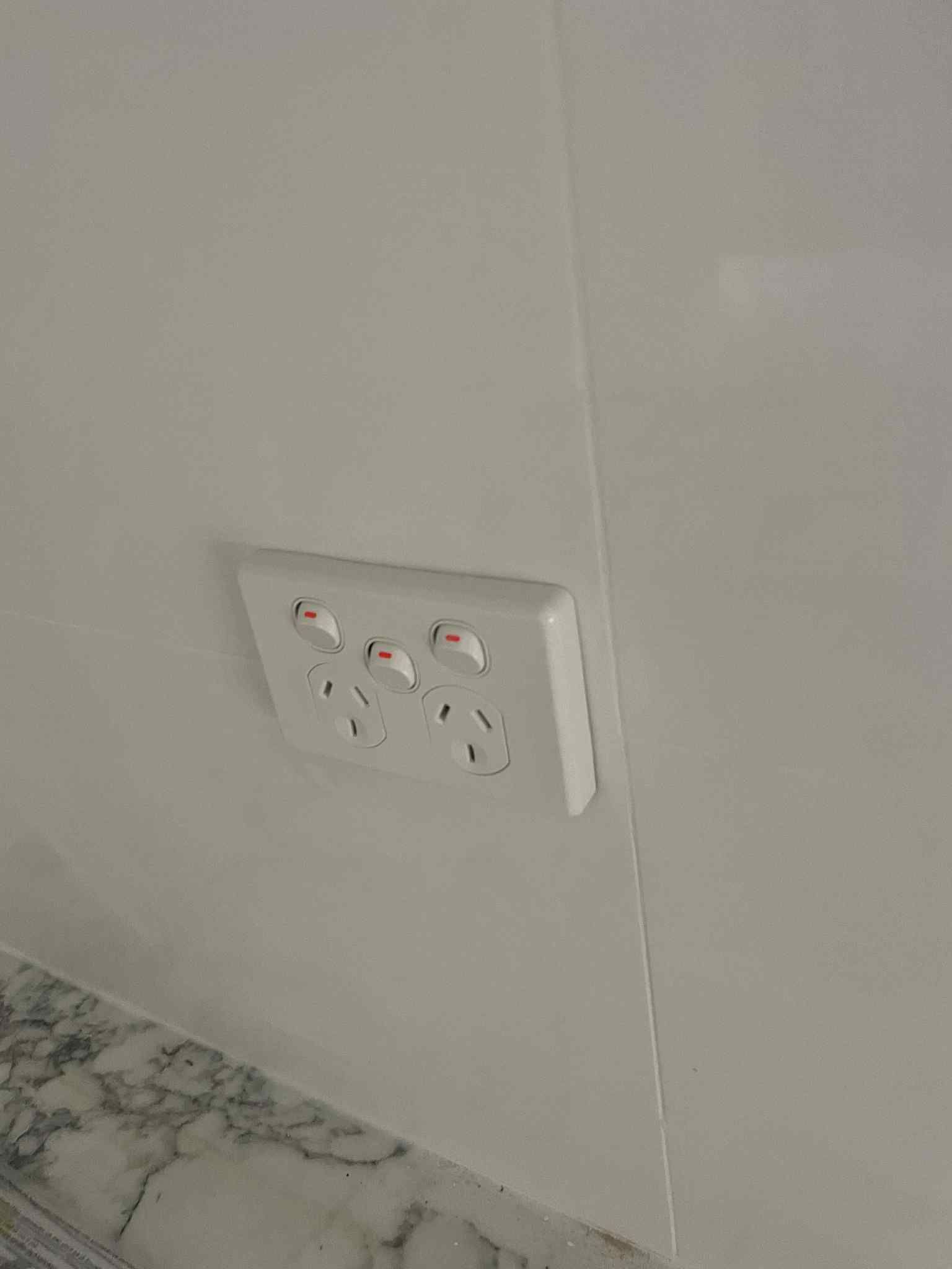 Dimmer switch control plate fitted in living room