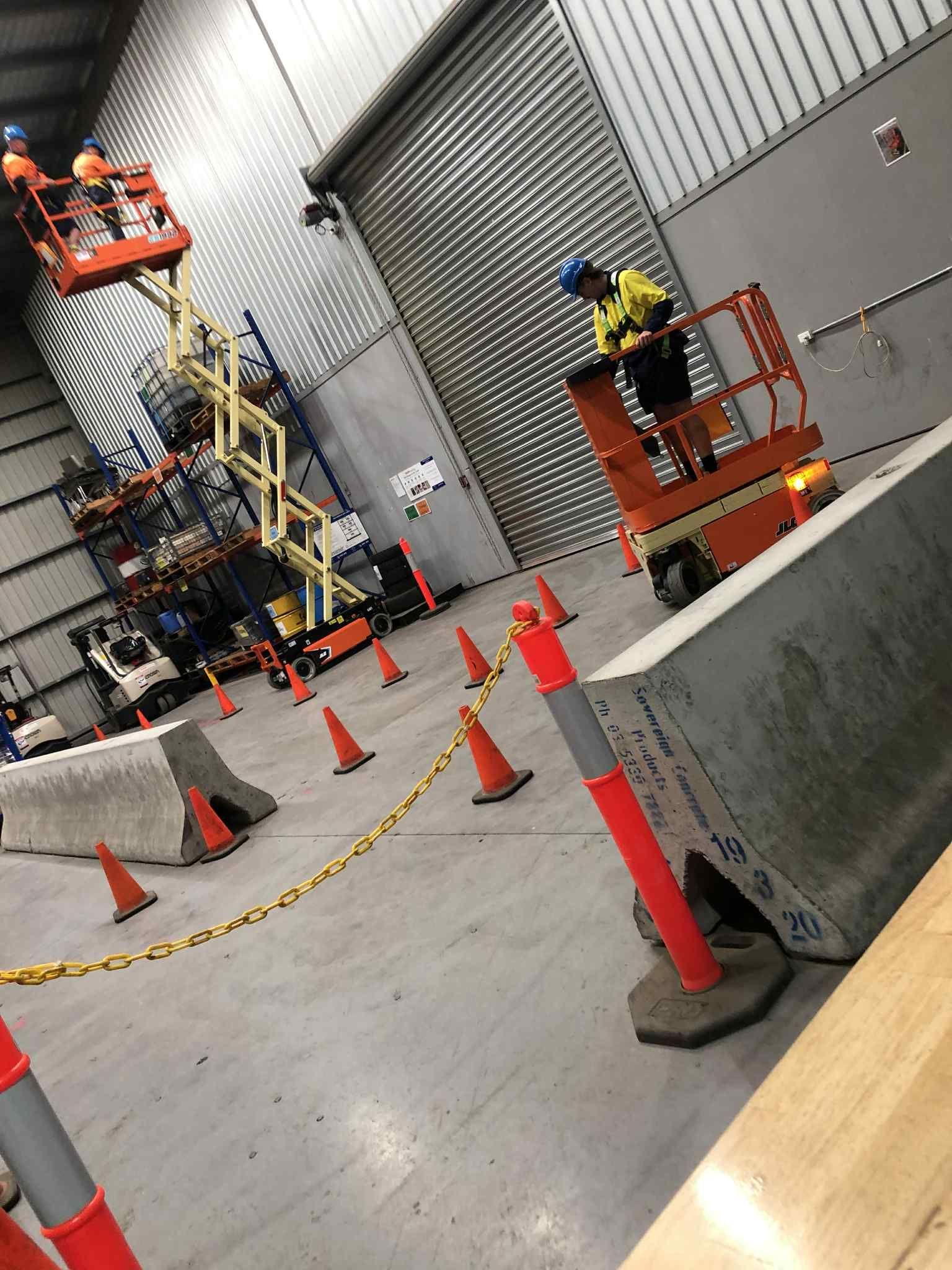 Worksite trenching with safety cones and temporary barriers during electrical installation in Melbourne.