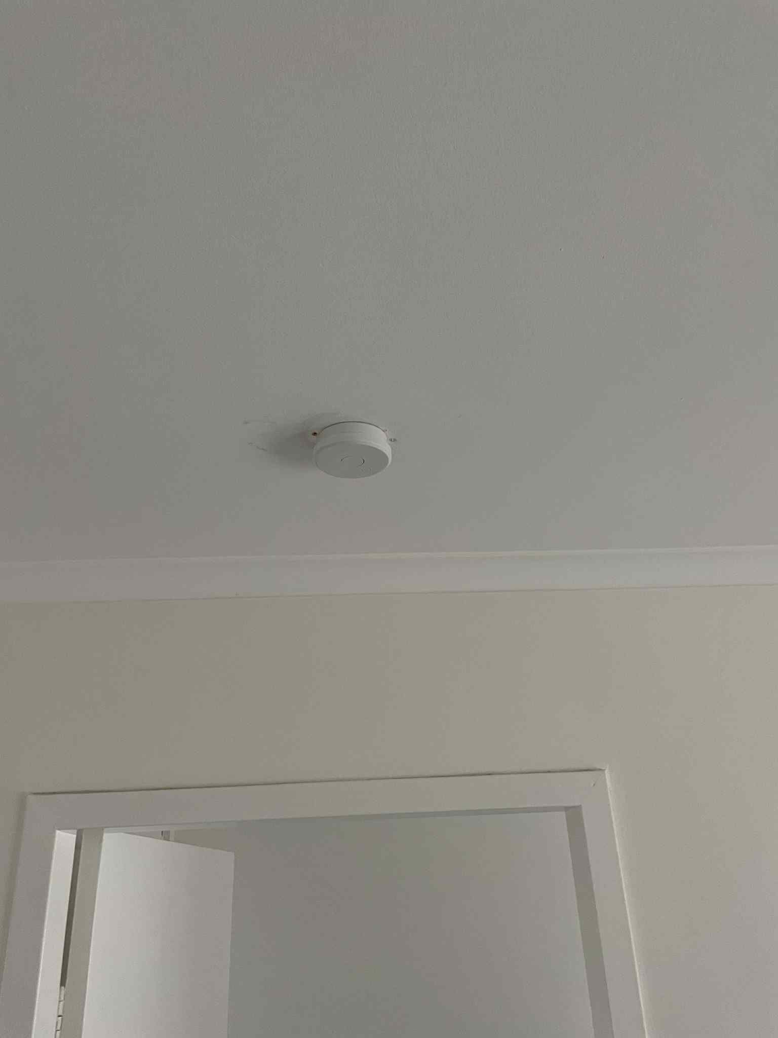 New smoke detector system installed across multiple rooms