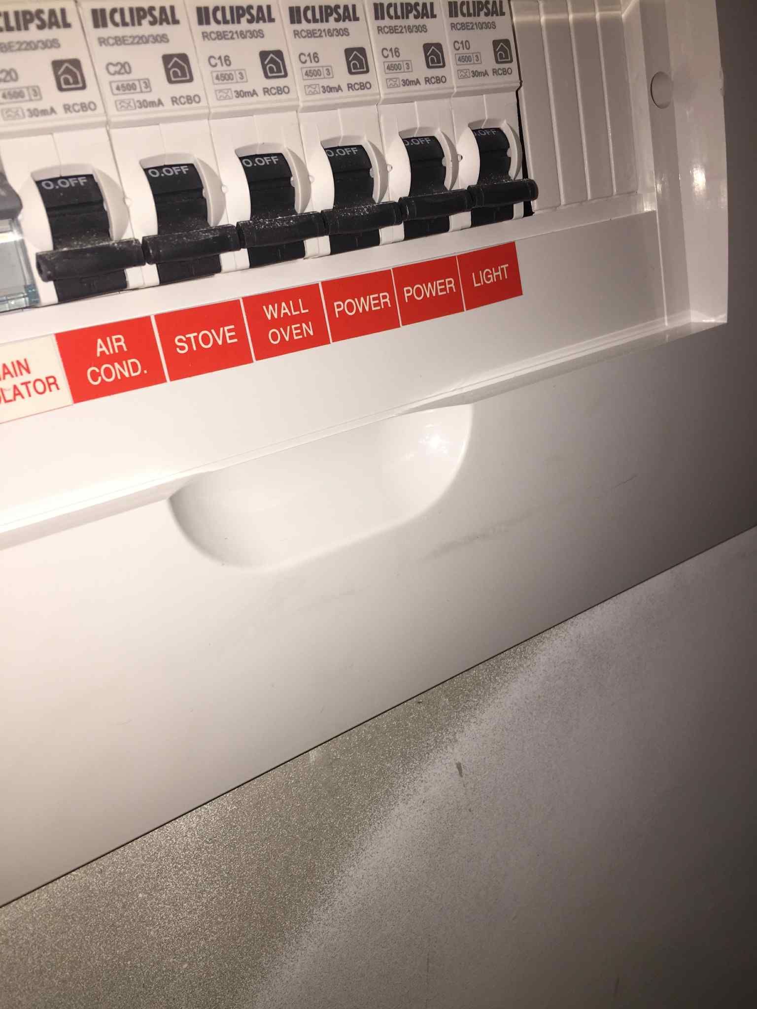 Close-up of switchboard door showing labelled circuit directory for a residential consumer unit.Bayside