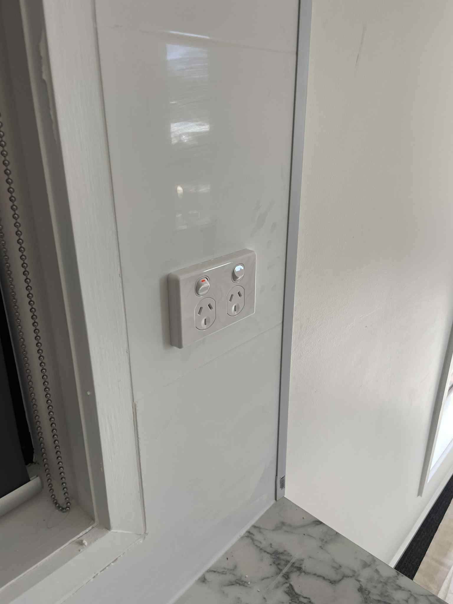 New light switches installed neatly on painted wall