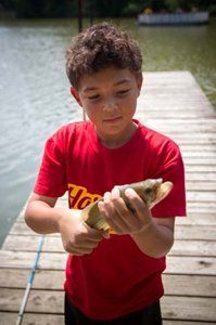 Boy Holding Fish
