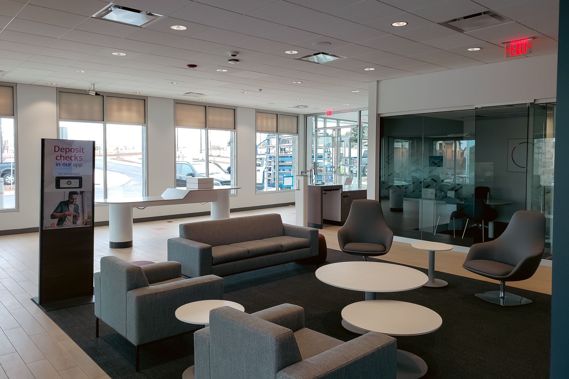 A living room with a couch and chairs in it