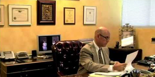 Attorney In Ft Lauderdale — Lawyer Reading Documents Inside An Office in Miami Lakes, FL