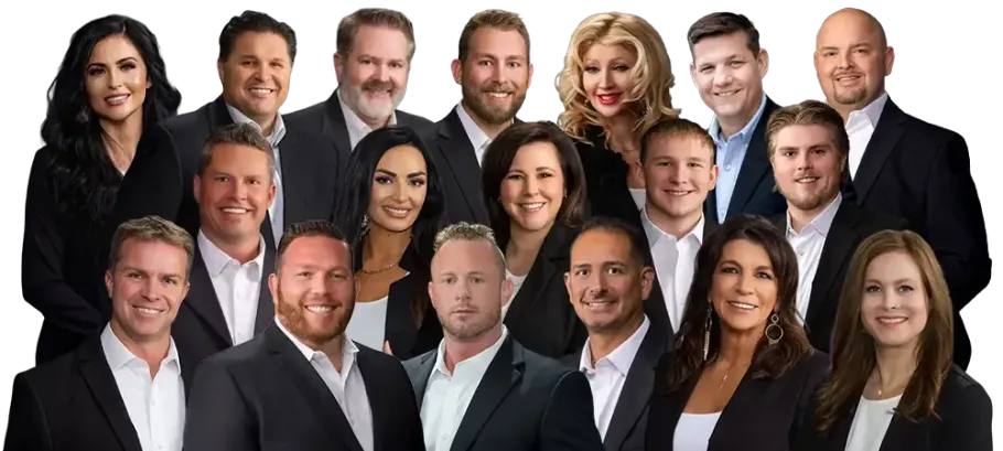 A group of people posing together, holding a picture of a building. They are smiling.