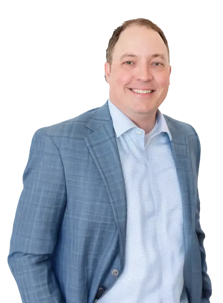 Russell Westergard Russell Westergard in a suit smiling, looking at the viewer. He is against a tansparent background.