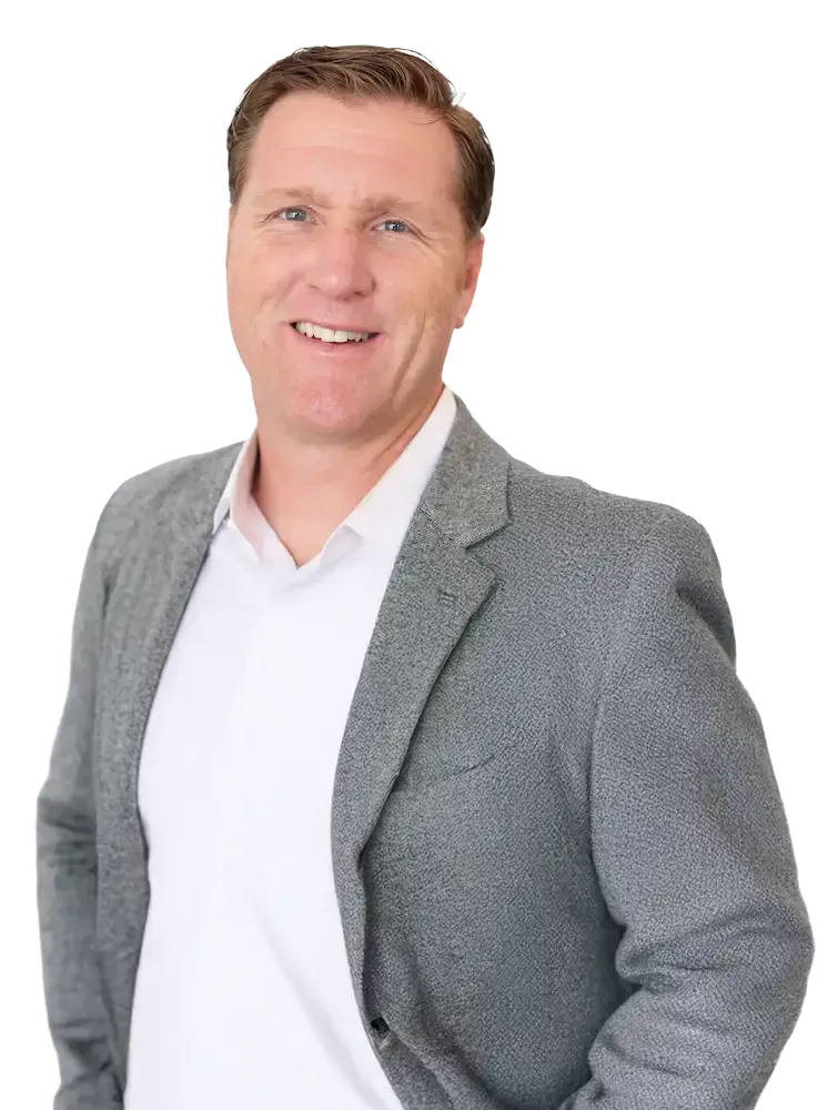 Scott Stratton Scott Stratton in a suit smiling, looking at the viewer. He is against a tansparent background.