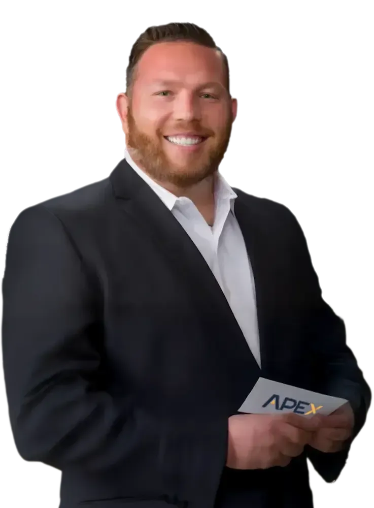 Trent Bright Trent Bright portrait in a suit smiles, looking at the viewer. He has a beard and is against a transparent background.