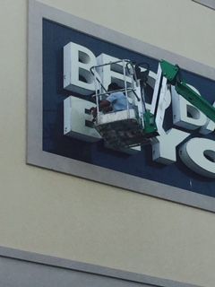 Worker in a lift repairing the