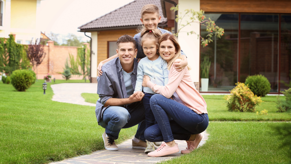 A person is spraying a carpet with a sprayer.