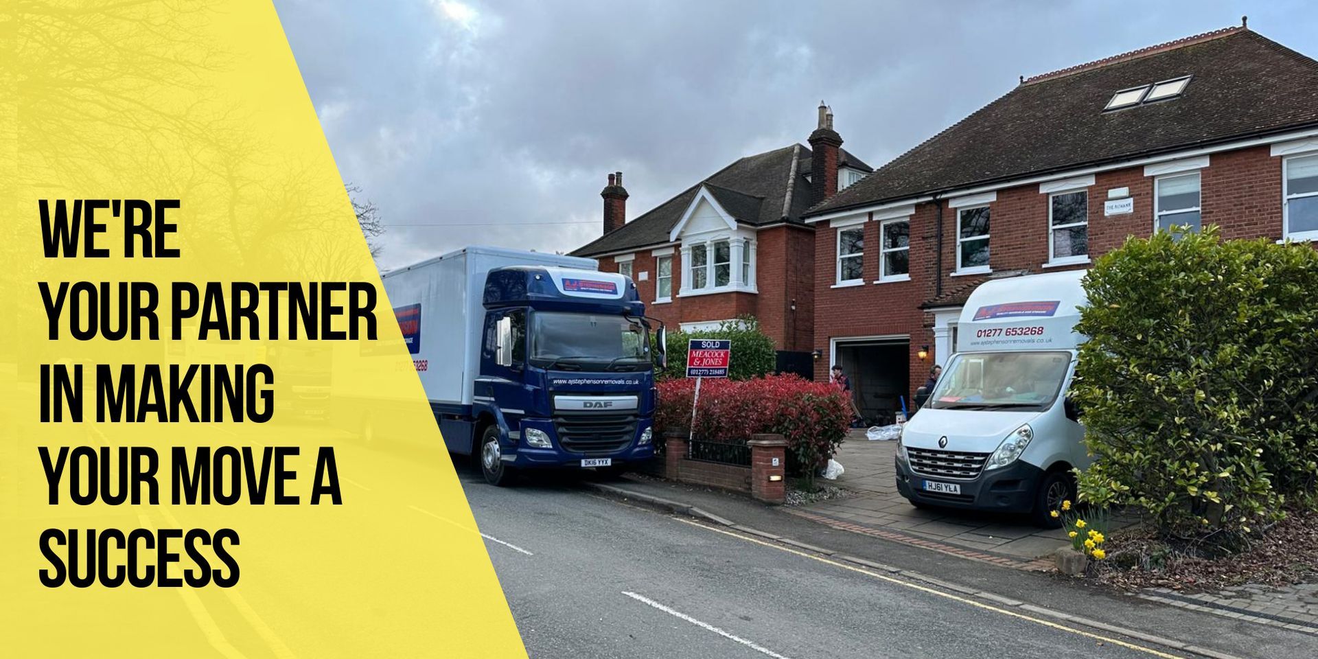 Two AJ Stephenson Removals moving lorries are parked on the side of a house of moving day