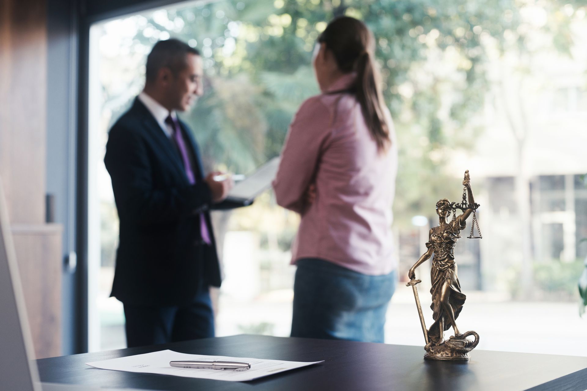 A police officer is giving a sobriety test to a young man.