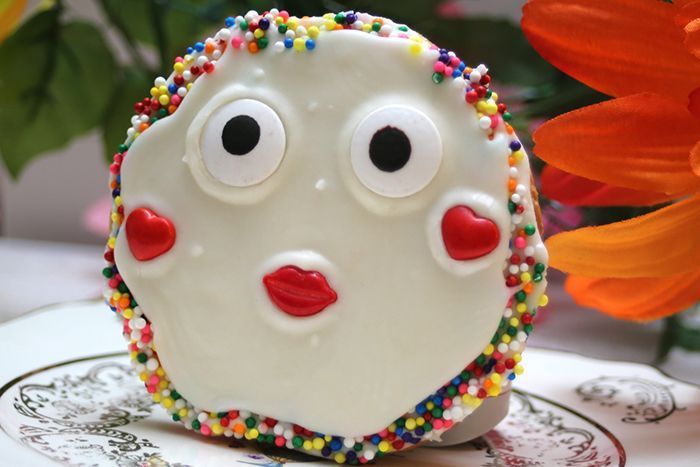 a cookie with googly eyes and sprinkles on it