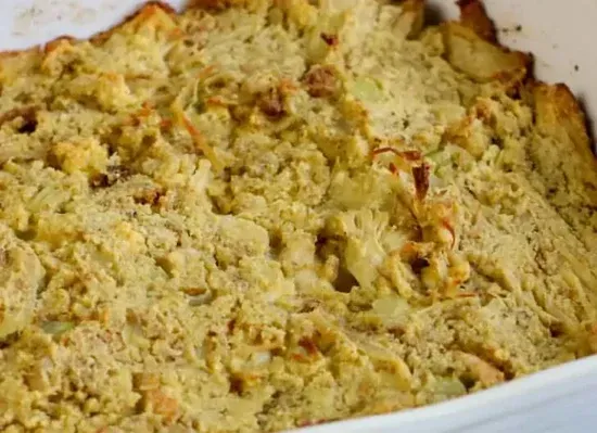 a close up of a casserole dish filled with food .