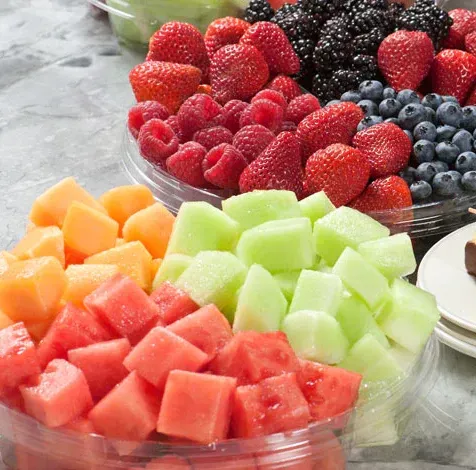 there are many different types of fruit in the bowls .