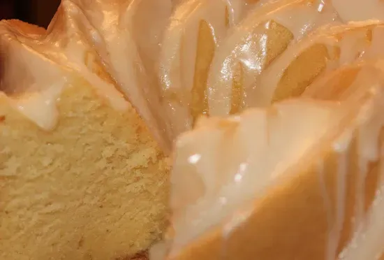 a close up of a bundt cake with icing on it .