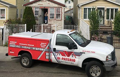 a di paterio truck is parked in front of a house .