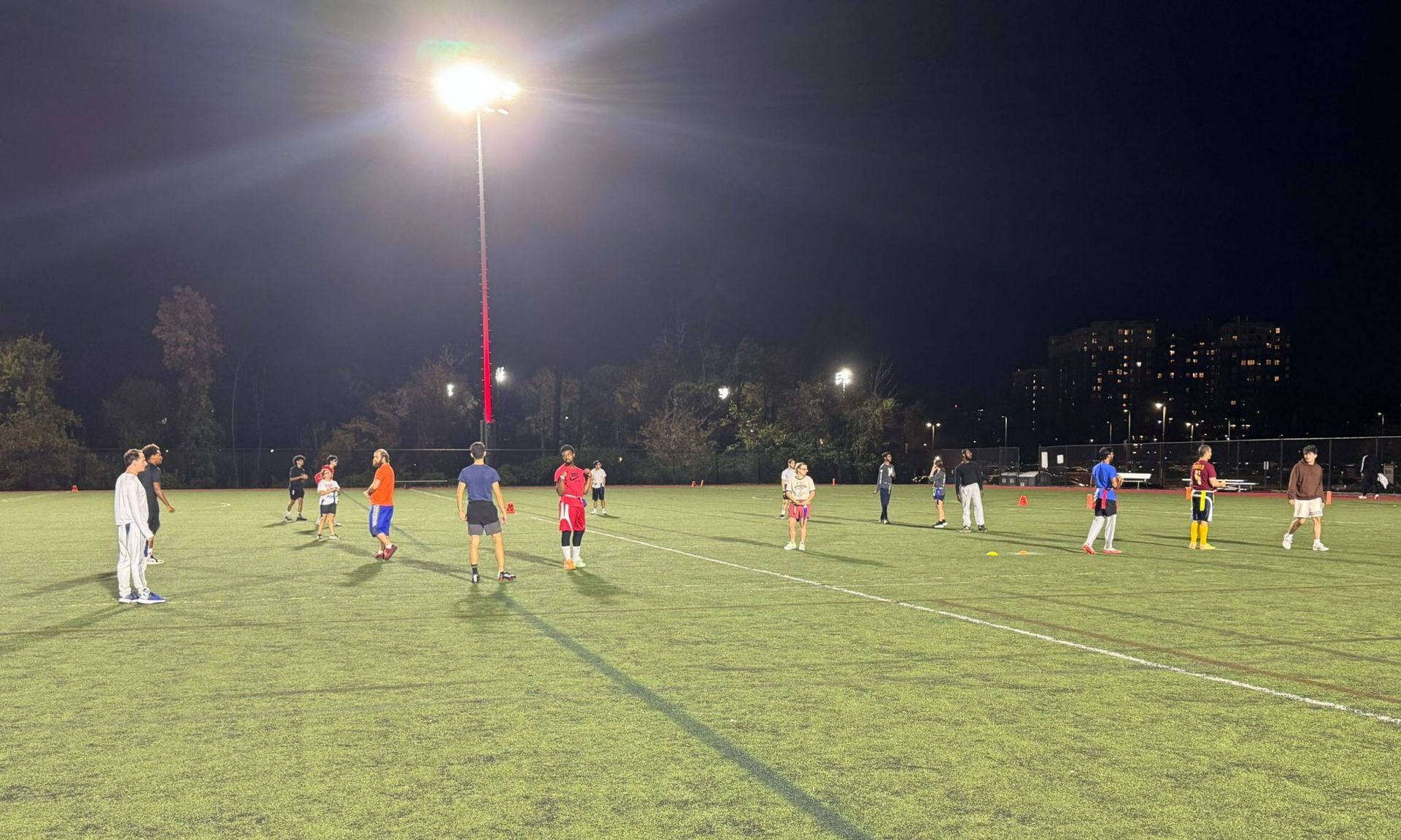 Players affiliated with Unified Sports Flag Football line up for the first play of the night