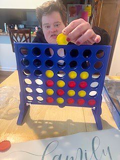 Bethany playing games with her staff (April 2026)