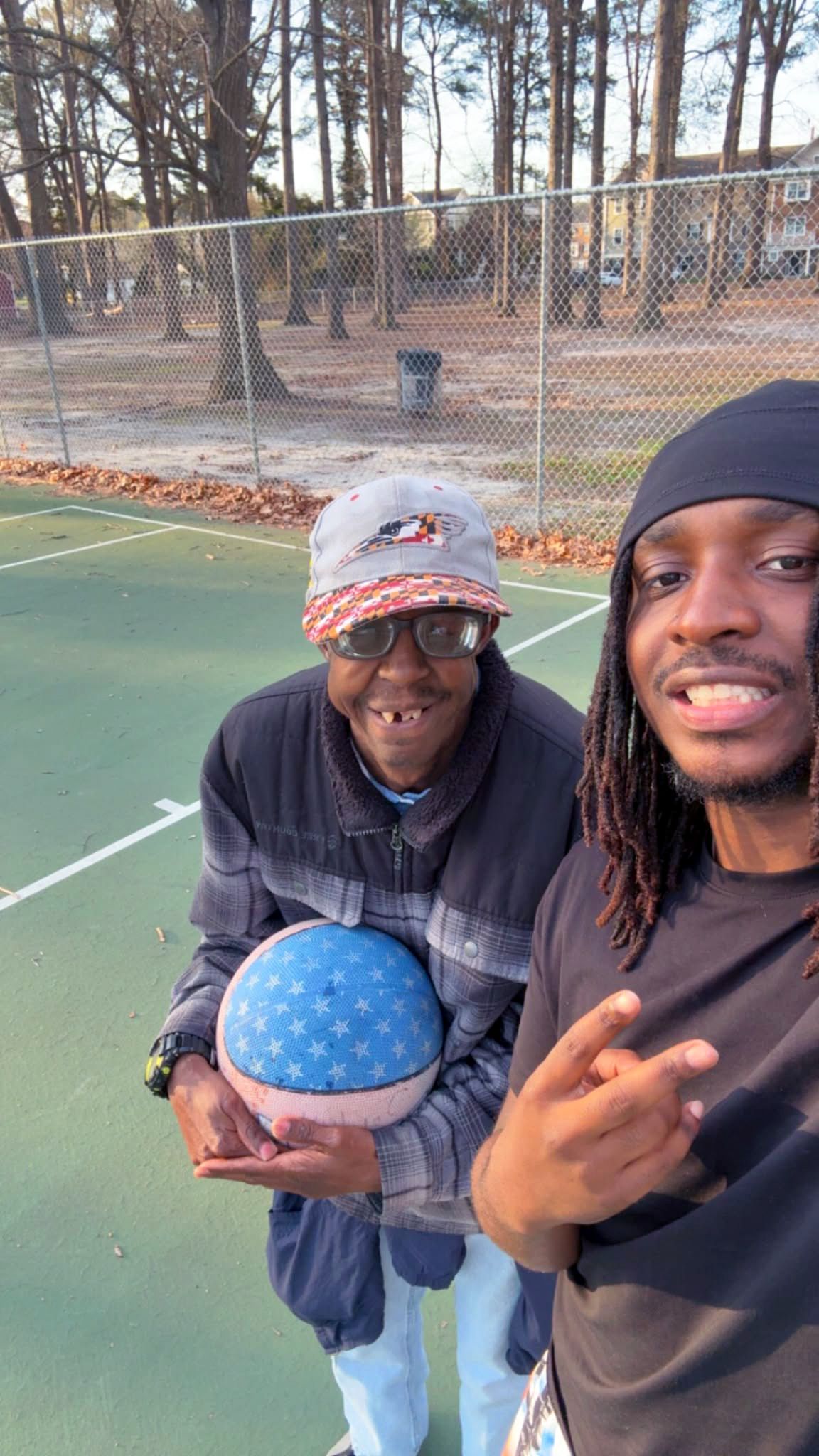 Marcus K. & mentor, Jahmare (April 2026)