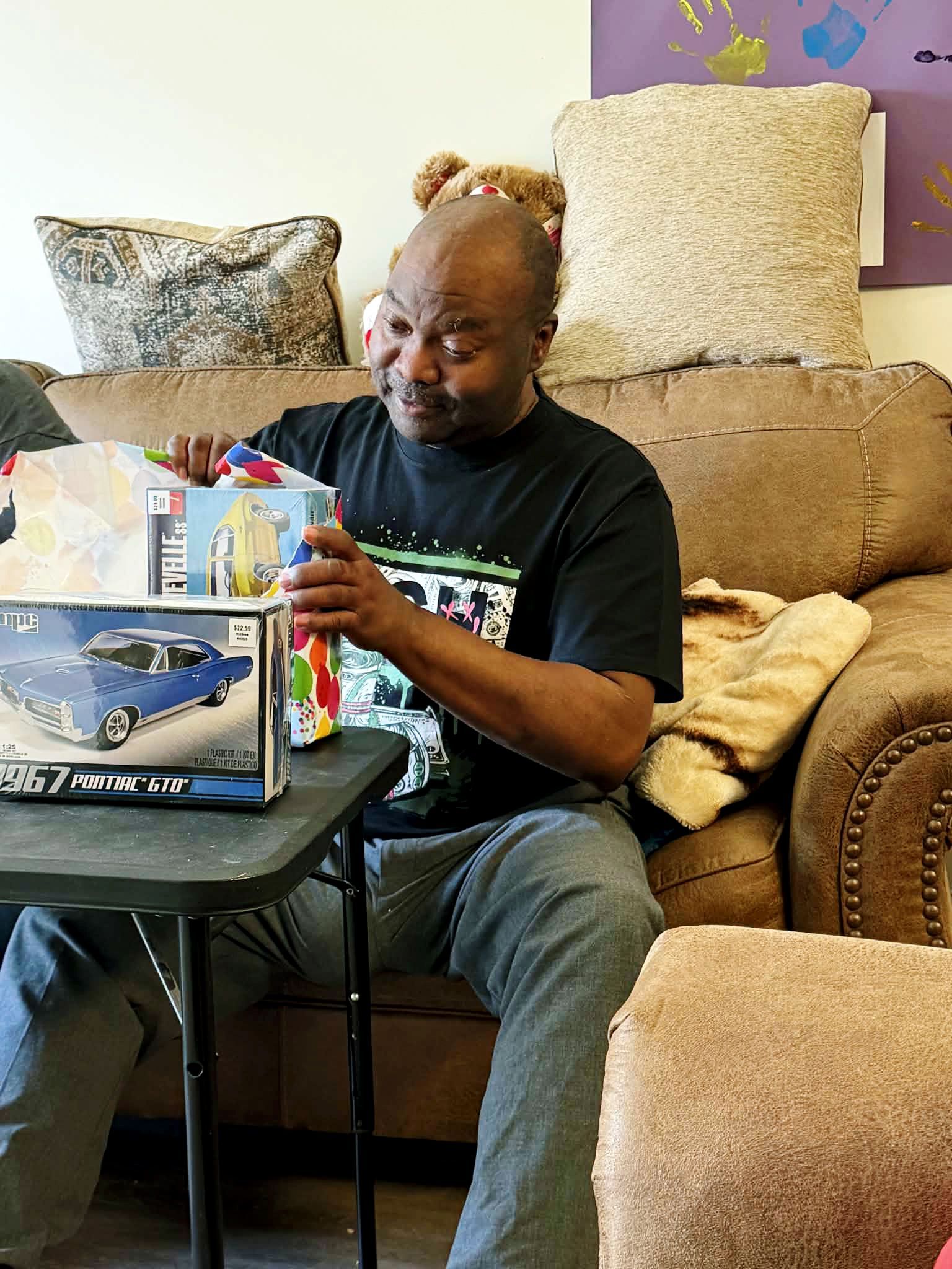 Mike opening his gift.