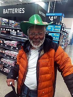 Avery in the St. Paddy's Day spirit in WalMart (2026.)