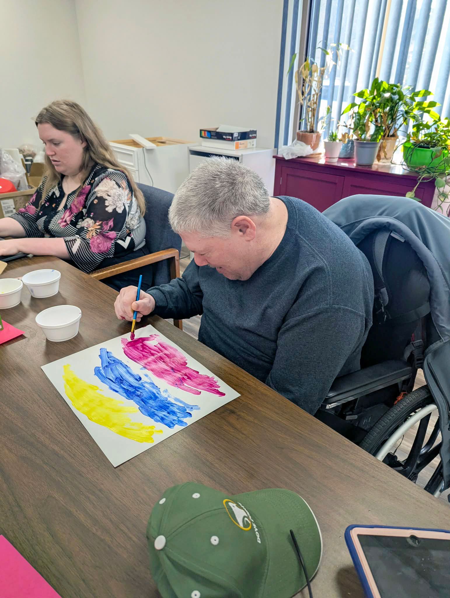 Robbie helping to decorate for Easter 2026 by painting a vibrant picture!