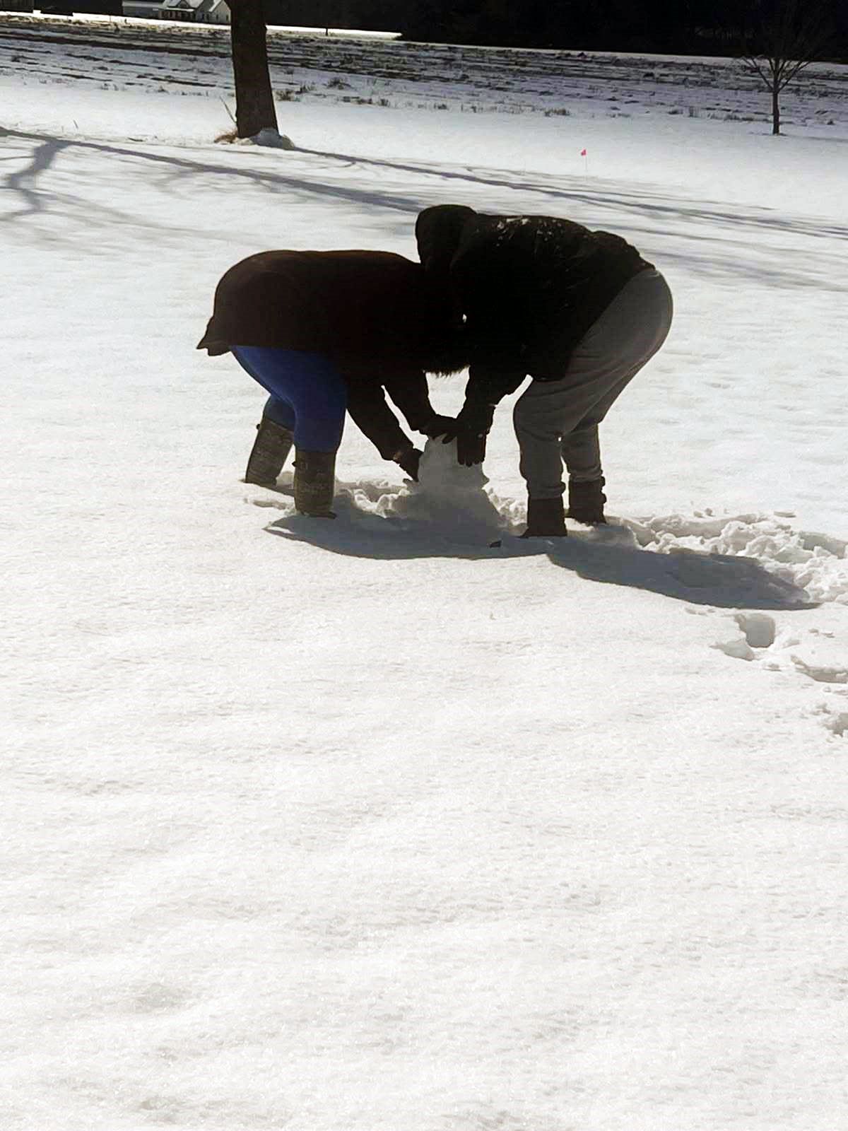 Wayne & Louis enjoying a snow day and building a snowman!