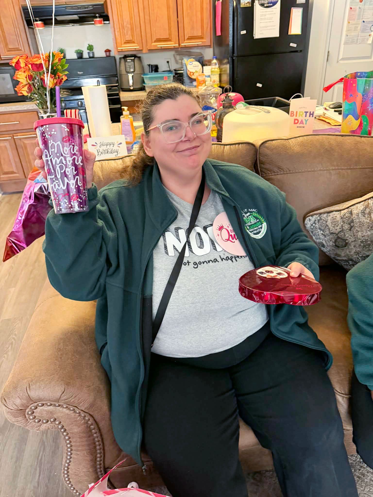 Tiffany R holding up her brand new cup.