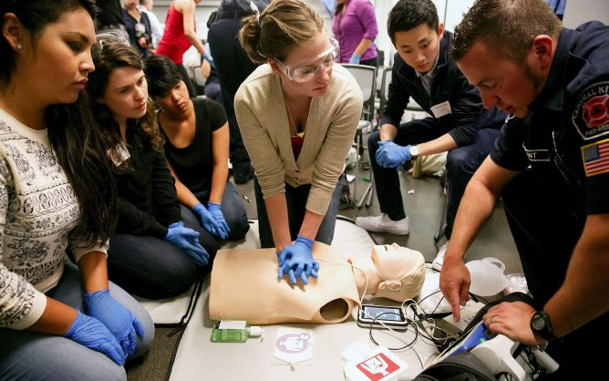 First-year medical students learn to use an automated external defibrillator. Federal funding will go toward developing trainings for students in health fields on treating people with developmental disabilities. (Erika Schultz/The Seattle Times/TNS)