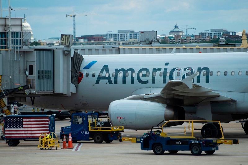 An American Airlines plane is seen at a gate at Ronald Reagan Washington National Airport in Arlington, Va., on May 12, 2020.  Andrew Caballero-Reynolds/AFP via Getty Images