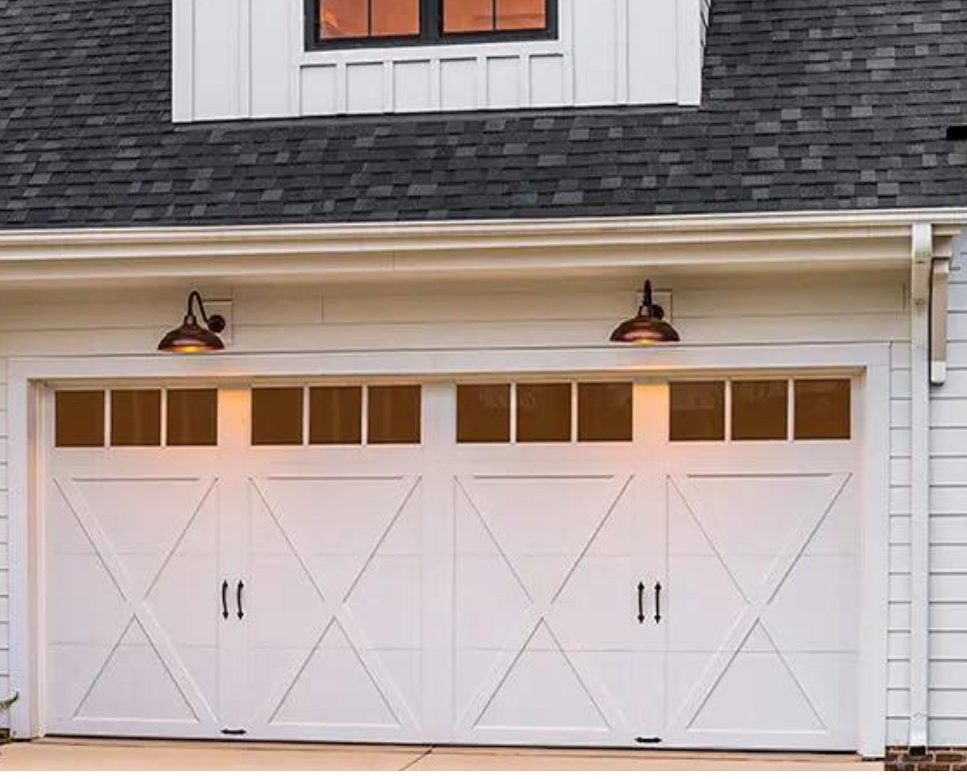 A white garage door with a window above it