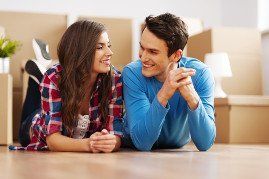 young couple smiling whilst having a conversation